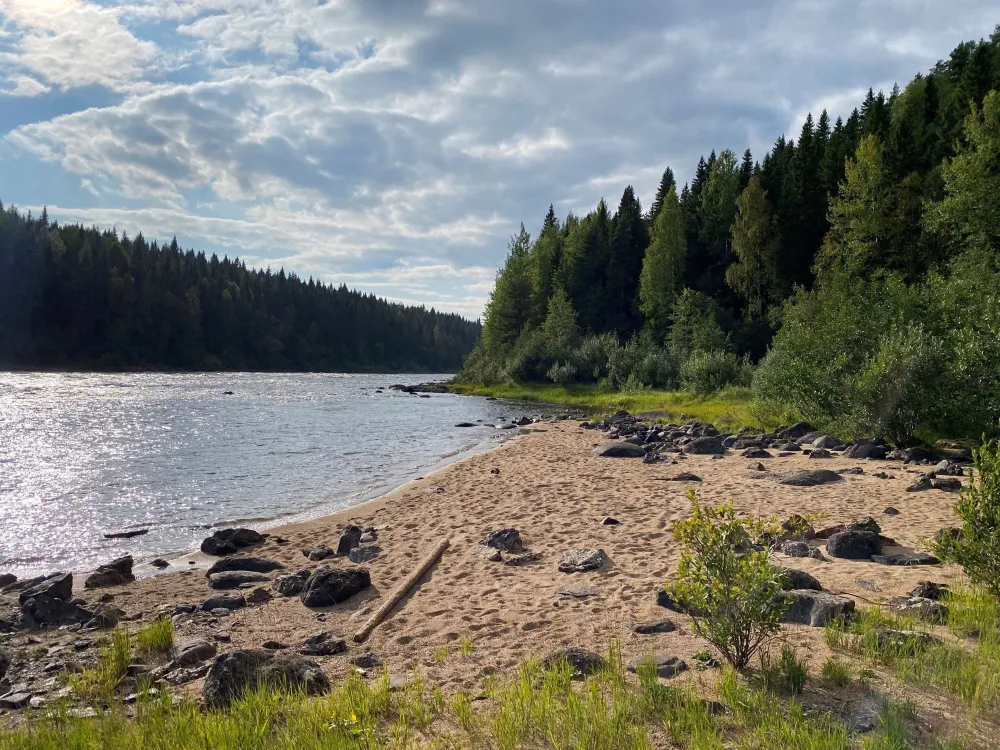 a small beach at the river